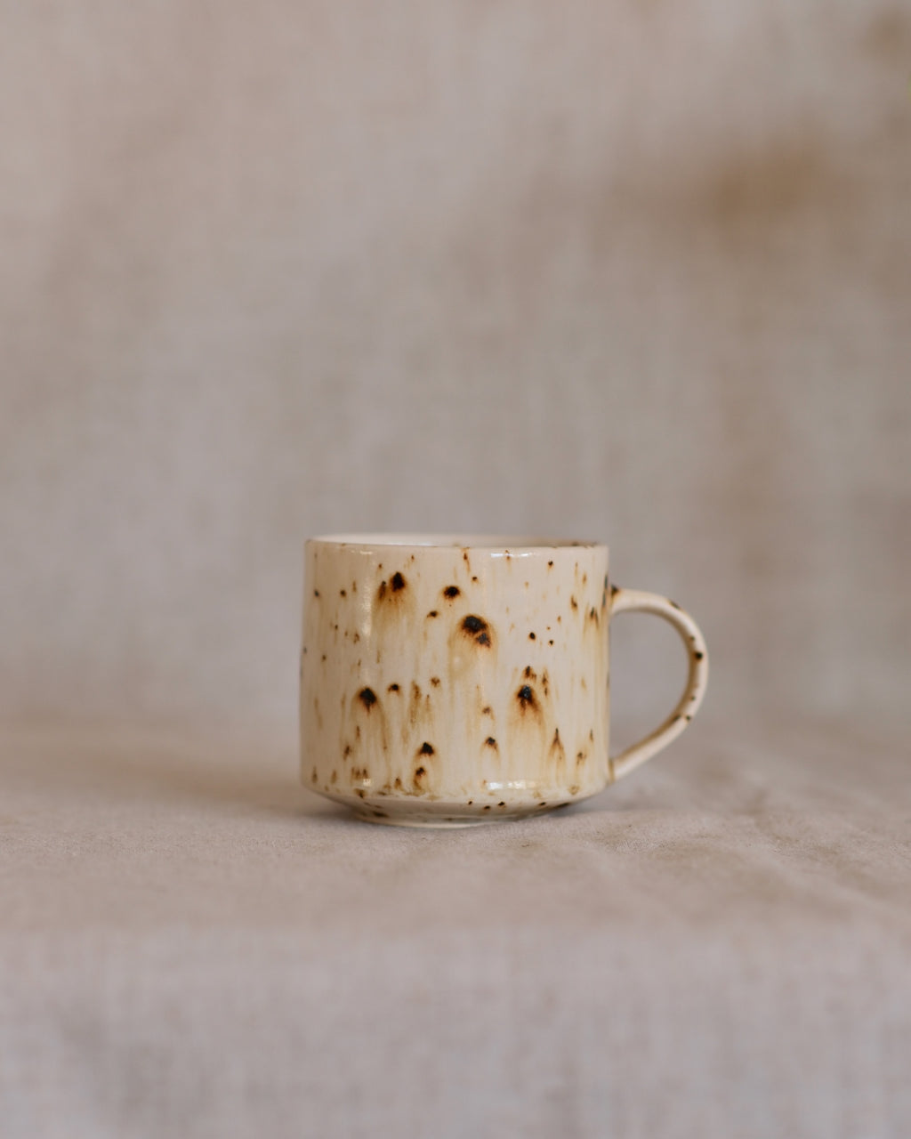Footed Mug in Metled Speckles