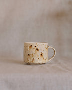 Footed Mug in Metled Speckles