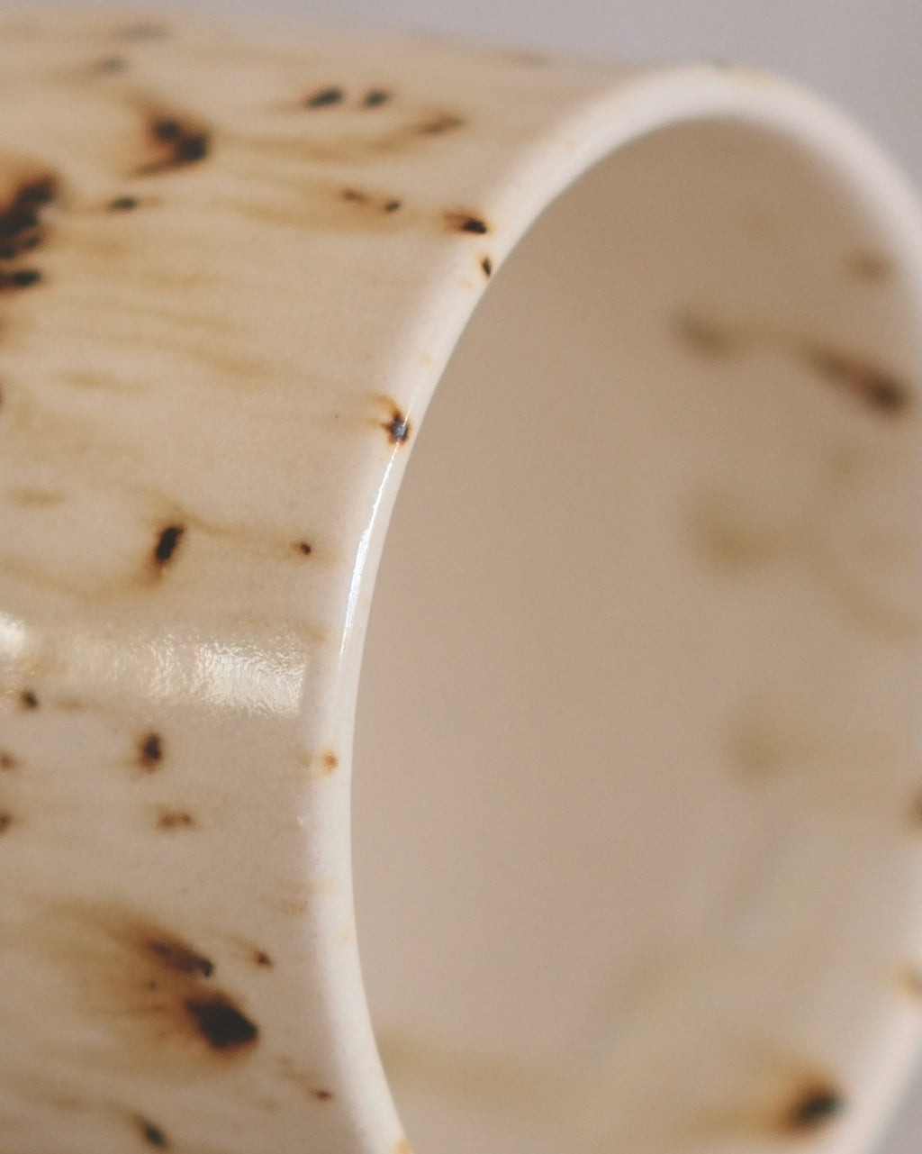 Footed Mug in Metled Speckles