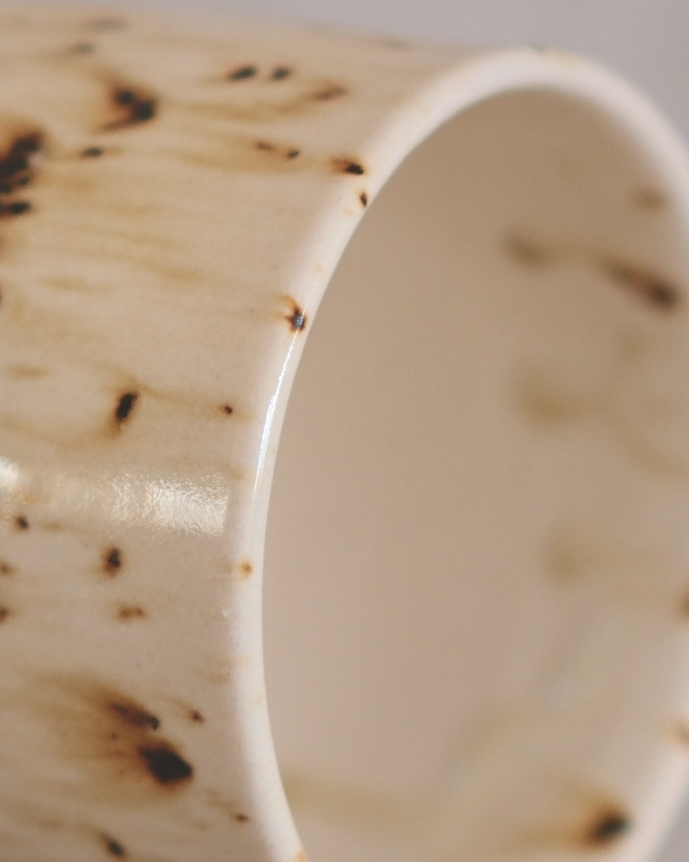 Footed Mug in Metled Speckles