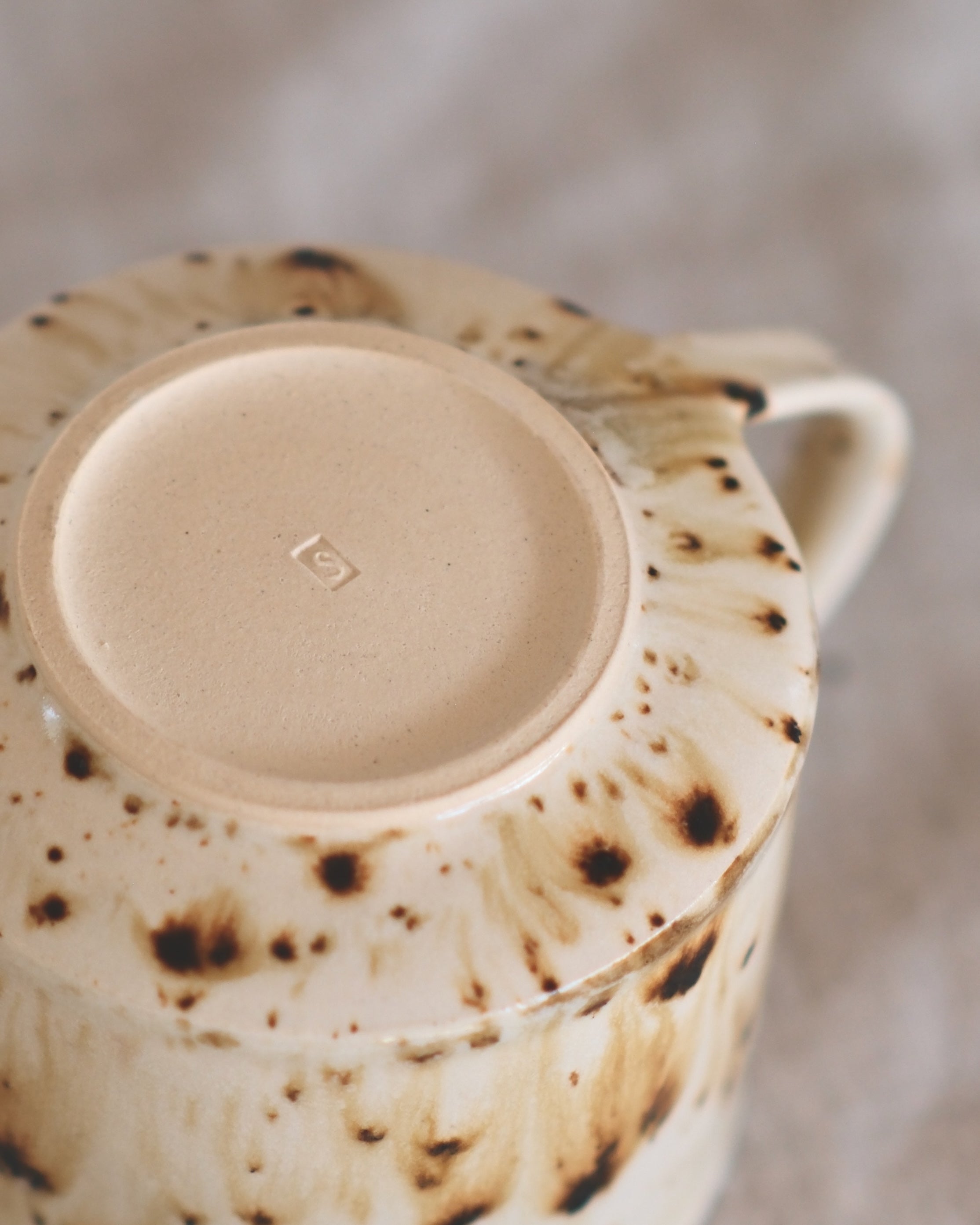 Footed Mug in Metled Speckles